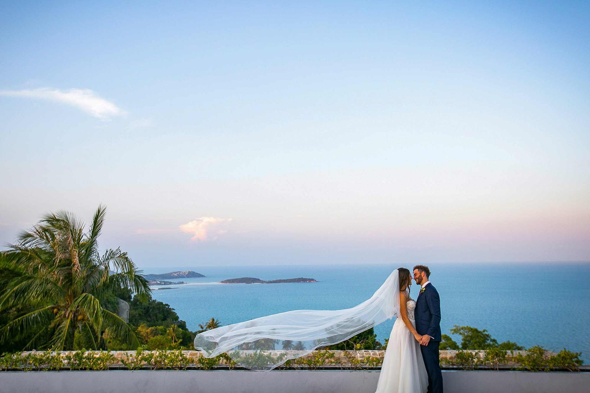 bride and groom with the ocean behind at villa koh koon in koh samui thailand