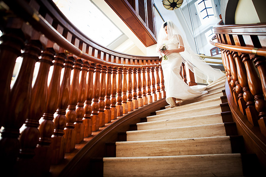 bride walks doen the staircase at the verandah repulse bay hong kong wedding photographer