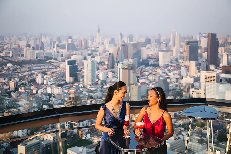Same sex couple at their photoshoot on a roof terrace in Bangkok